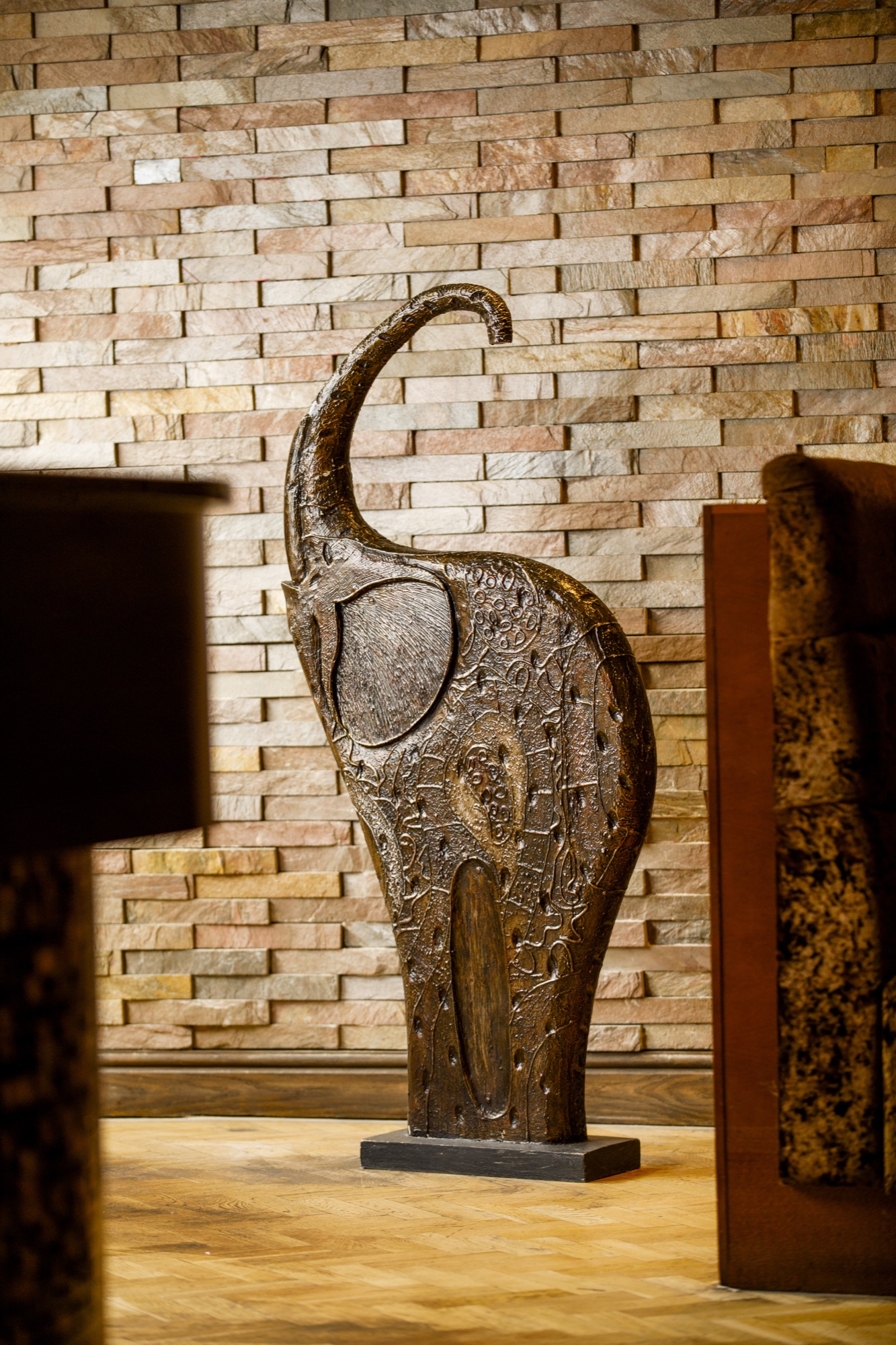 Lounge area with hand-carved wooden seating
