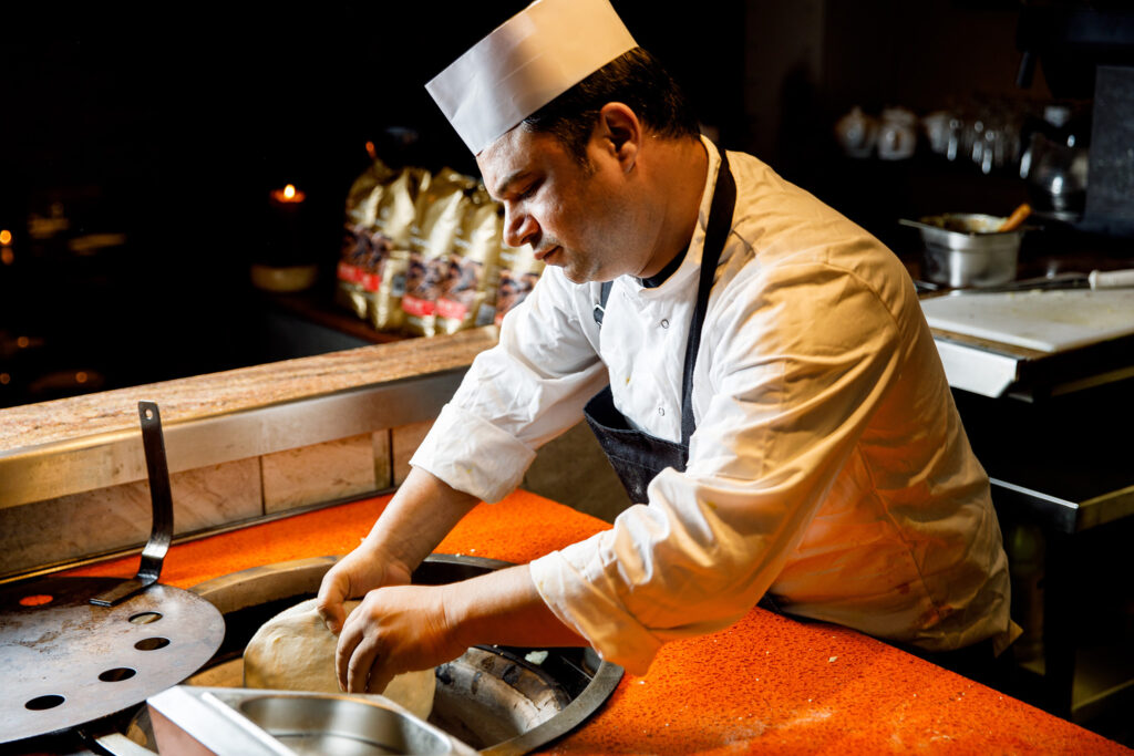 Chef cooking naan